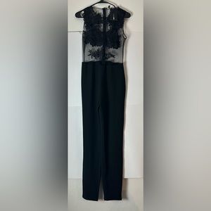 New Fashion Nova Black Jumpsuit with peek a boo sides
